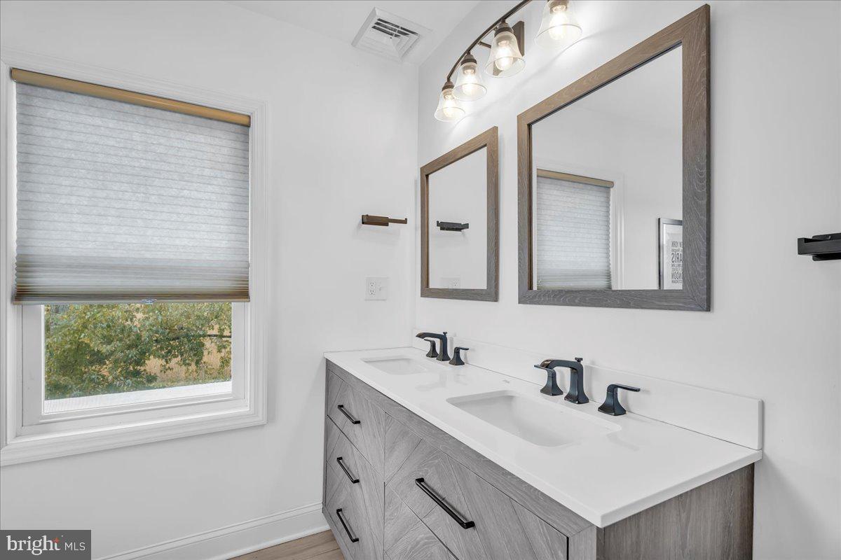 128 Cedarbrook Road Sicklerville, NJ 08081 - Photo 19 of 33 a bathroom with a sink vanity and a mirror