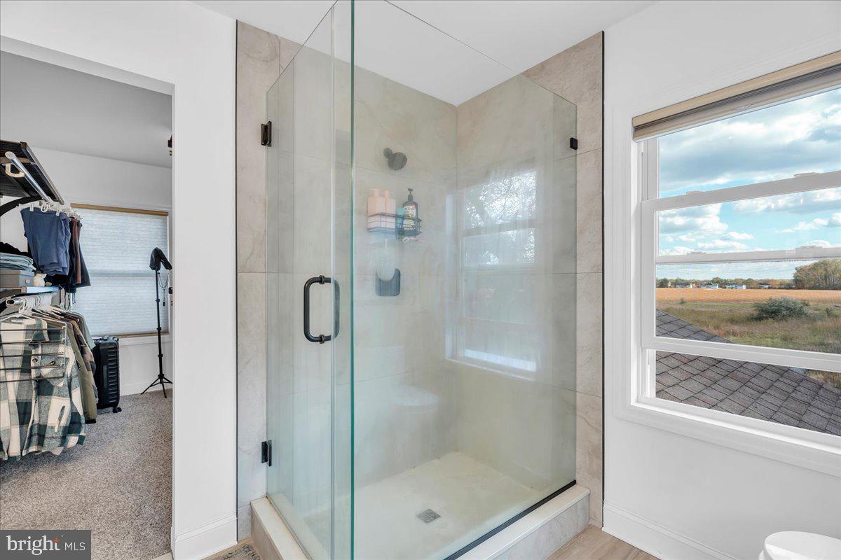 128 Cedarbrook Road Sicklerville, NJ 08081 - Photo 20 of 33 a bathroom with a glass shower door and a window