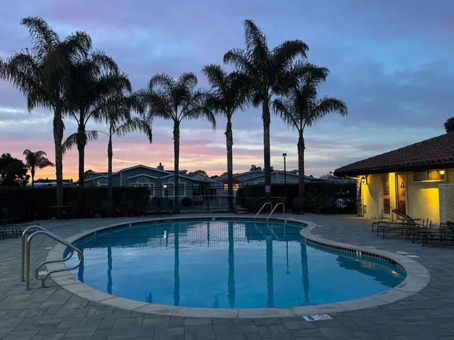 a view of outdoor space with swimming pool and lounge chair