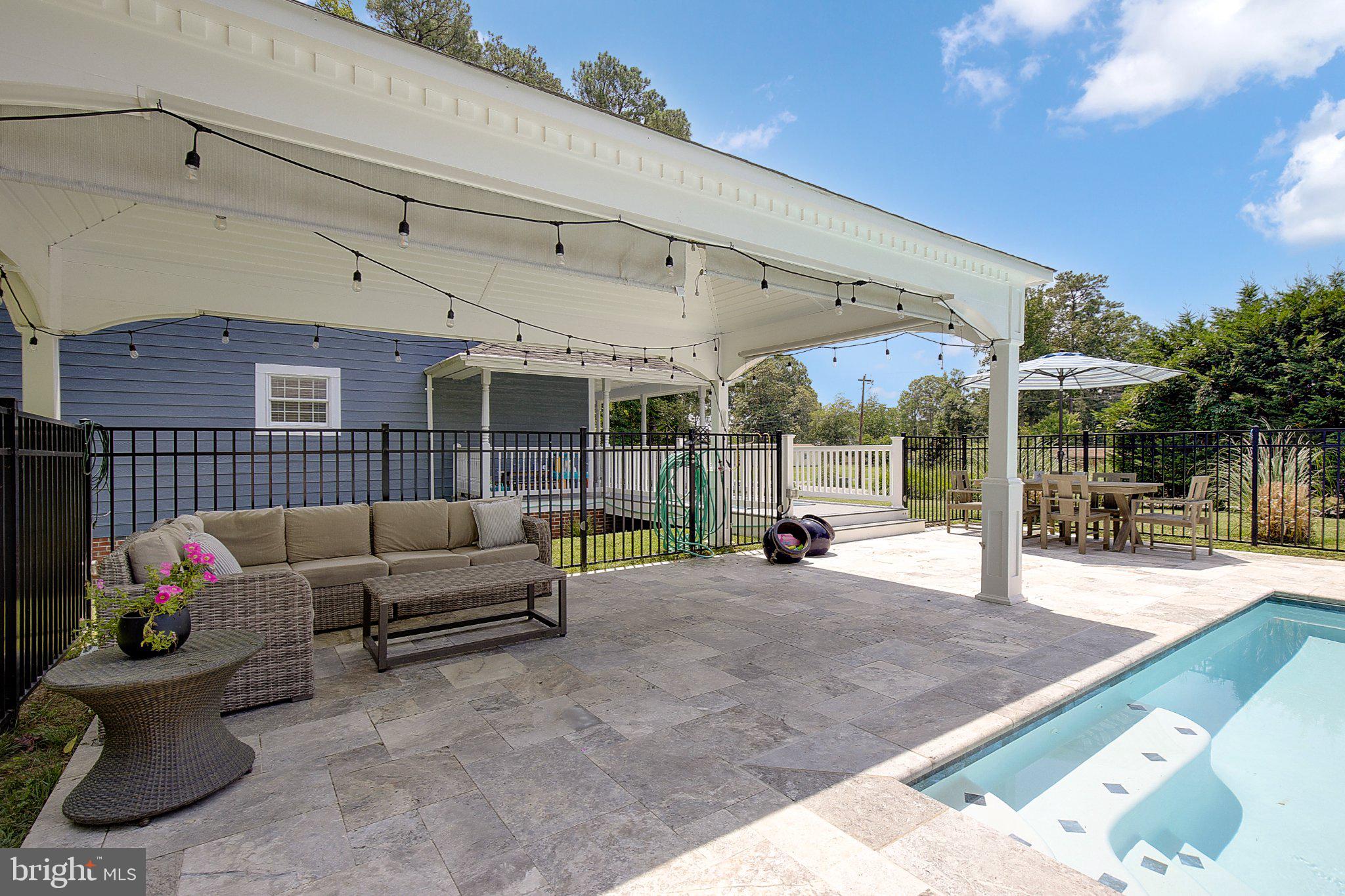 980 Apple Lane Solomons, MD 20629 - Photo 52 of 82 Serene outdoor retreat with poolside charm.