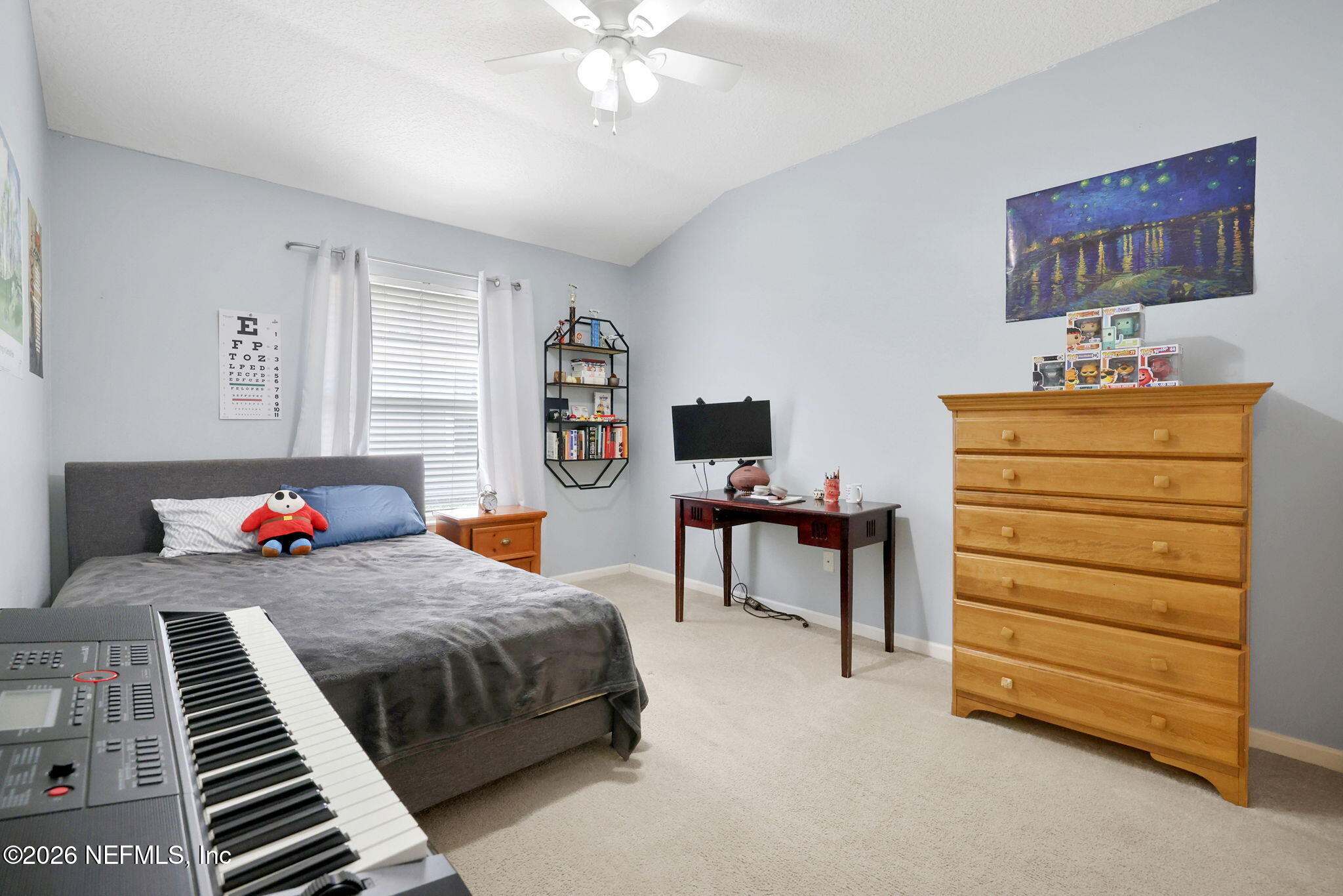 4320 Rye Court St. Johns, FL 32259 - Photo 40 of 60 a bedroom with a bed and a chandelier