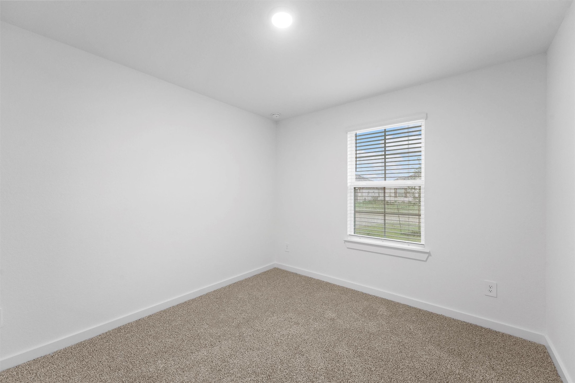 1115 Briscoe Court Rosharon, TX 77583 - Photo 2 of 16 an empty room with a window