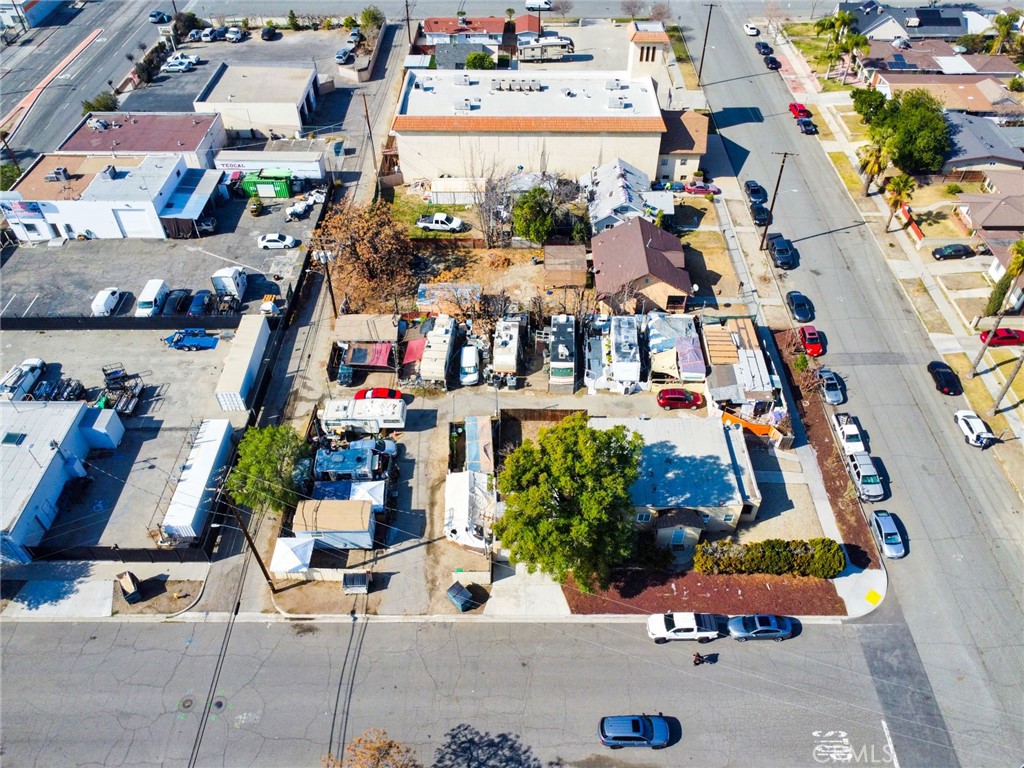584 East H Street, Unit 111 Colton, CA 92324 - Photo 5 of 18 an aerial view of residential houses and outdoor space