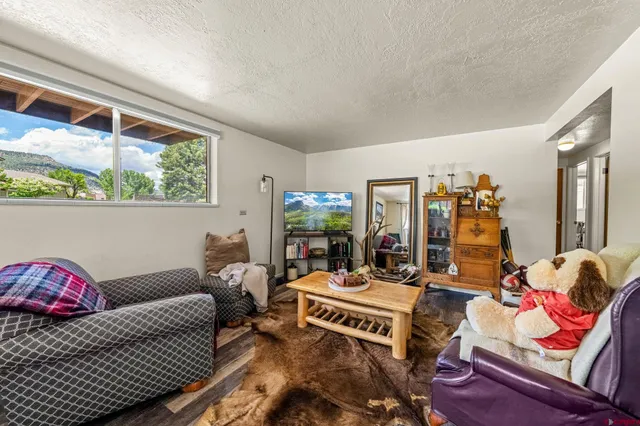 a kitchen with a sink window and cabinets