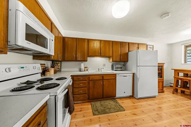 a view of a dining room with furniture and a window