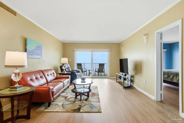 a living room with furniture and a table