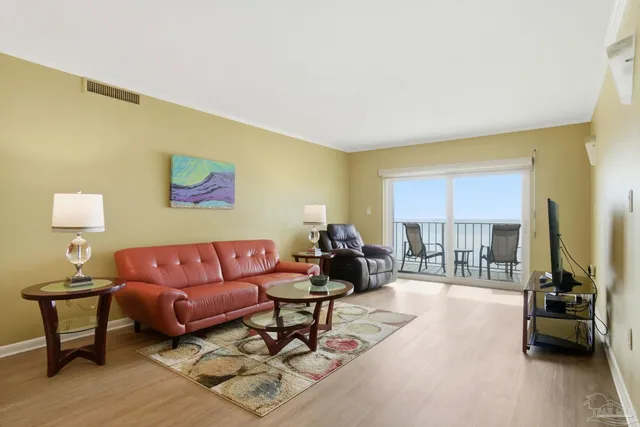 a living room with furniture and a lamp