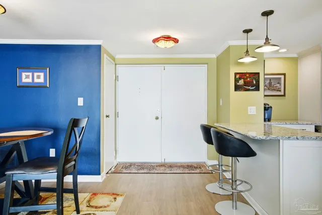a dining room with furniture and chandelier