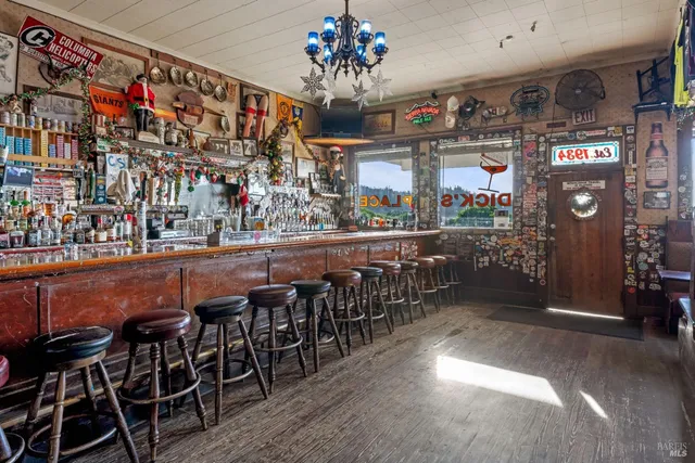 a kitchen with stainless steel appliances granite countertop a stove and a refrigerator