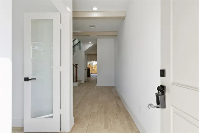 a view of a bathroom from a hallway