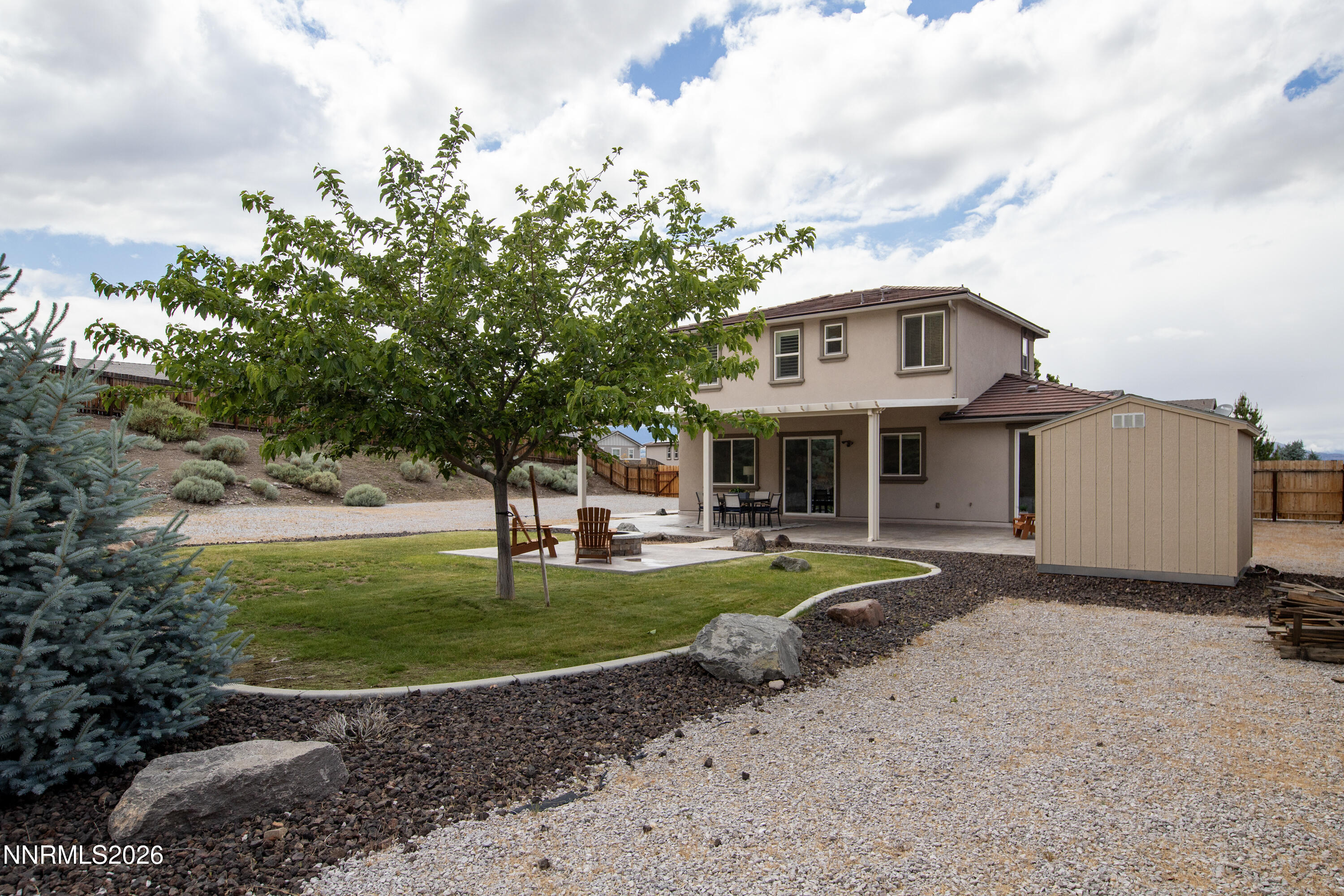 10150 Barrel Racer Drive Reno, NV 89521 - Photo 60 of 64 a view of a house with garden yard and sitting area