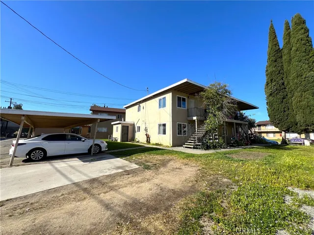 a view of a cars parked in front of a house