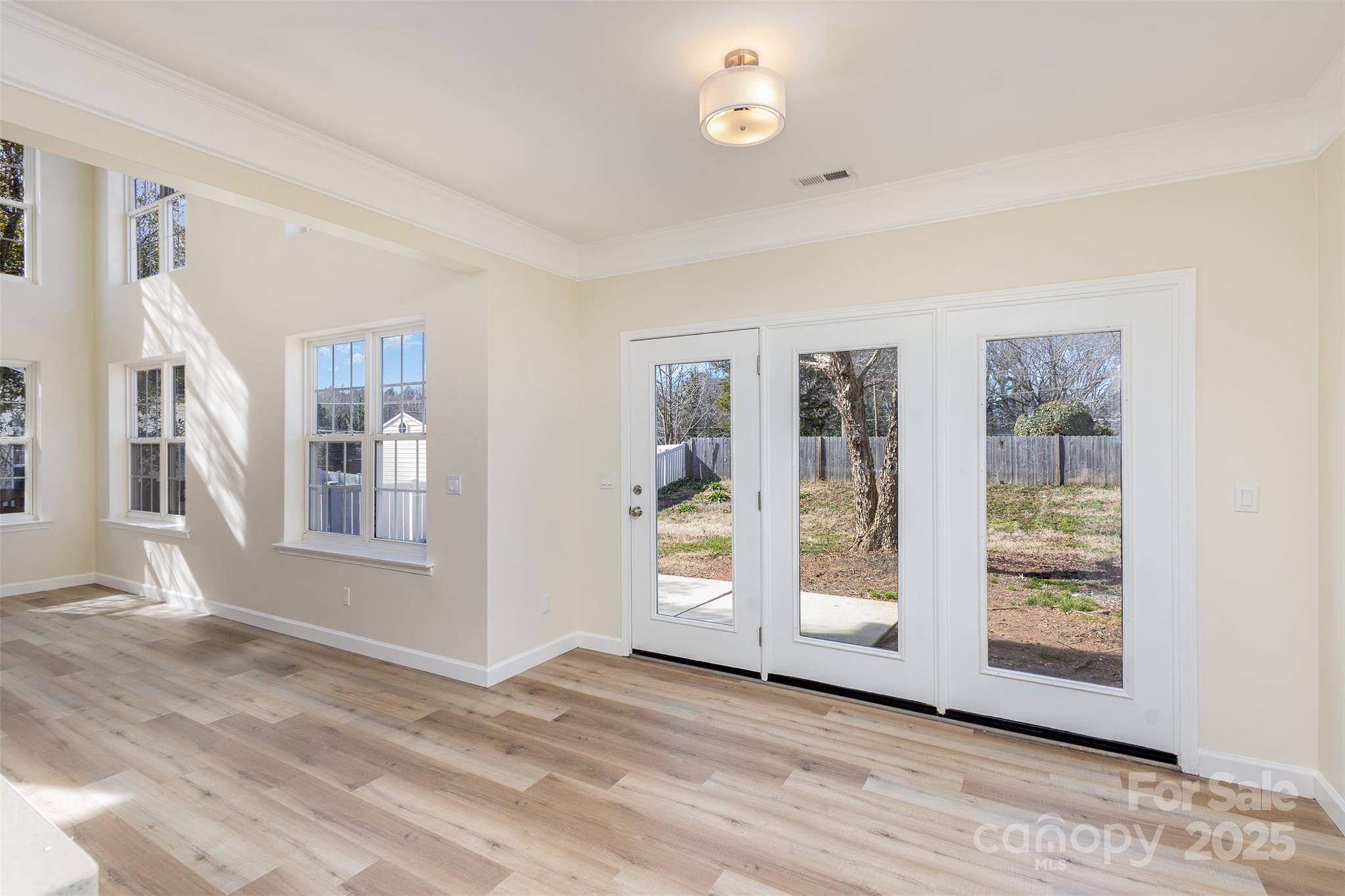 132 Elizabeth Hearth Road Mooresville, NC 28115 - Photo 12 of 40 a view of an empty room with glass door