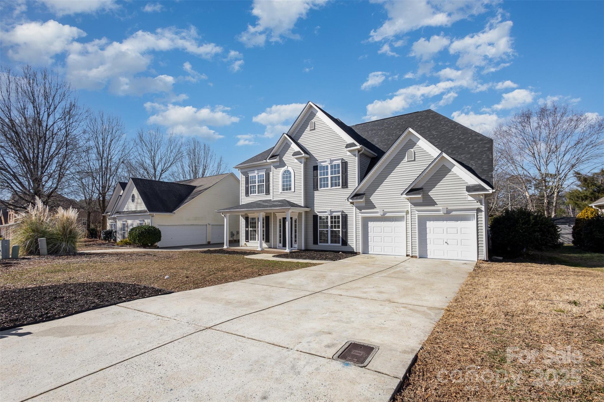 132 Elizabeth Hearth Road Mooresville, NC 28115 - Photo 2 of 40 a front view of a house with a yard and trees