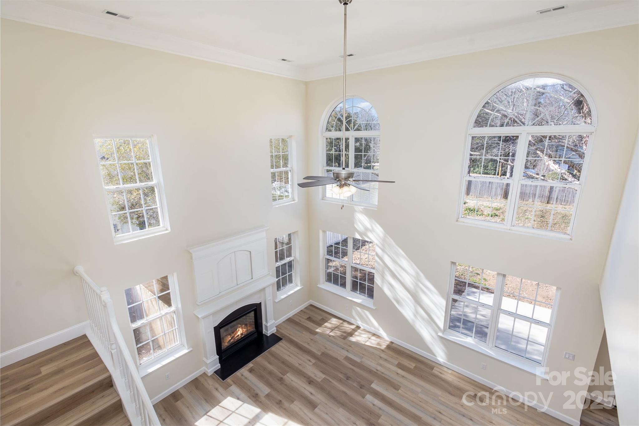 132 Elizabeth Hearth Road Mooresville, NC 28115 - Photo 21 of 40 a view of an entryway with wooden floor fireplace and a window