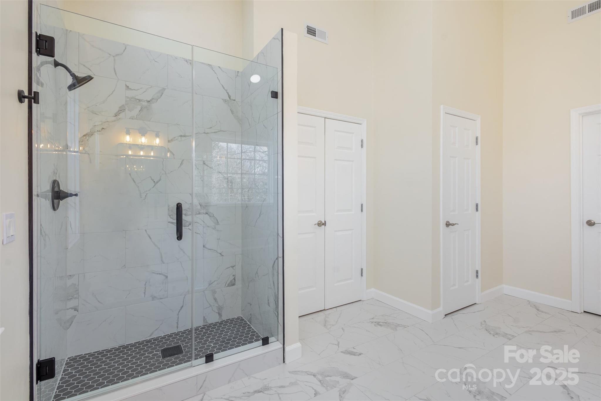 132 Elizabeth Hearth Road Mooresville, NC 28115 - Photo 27 of 40 a bathroom with a shower