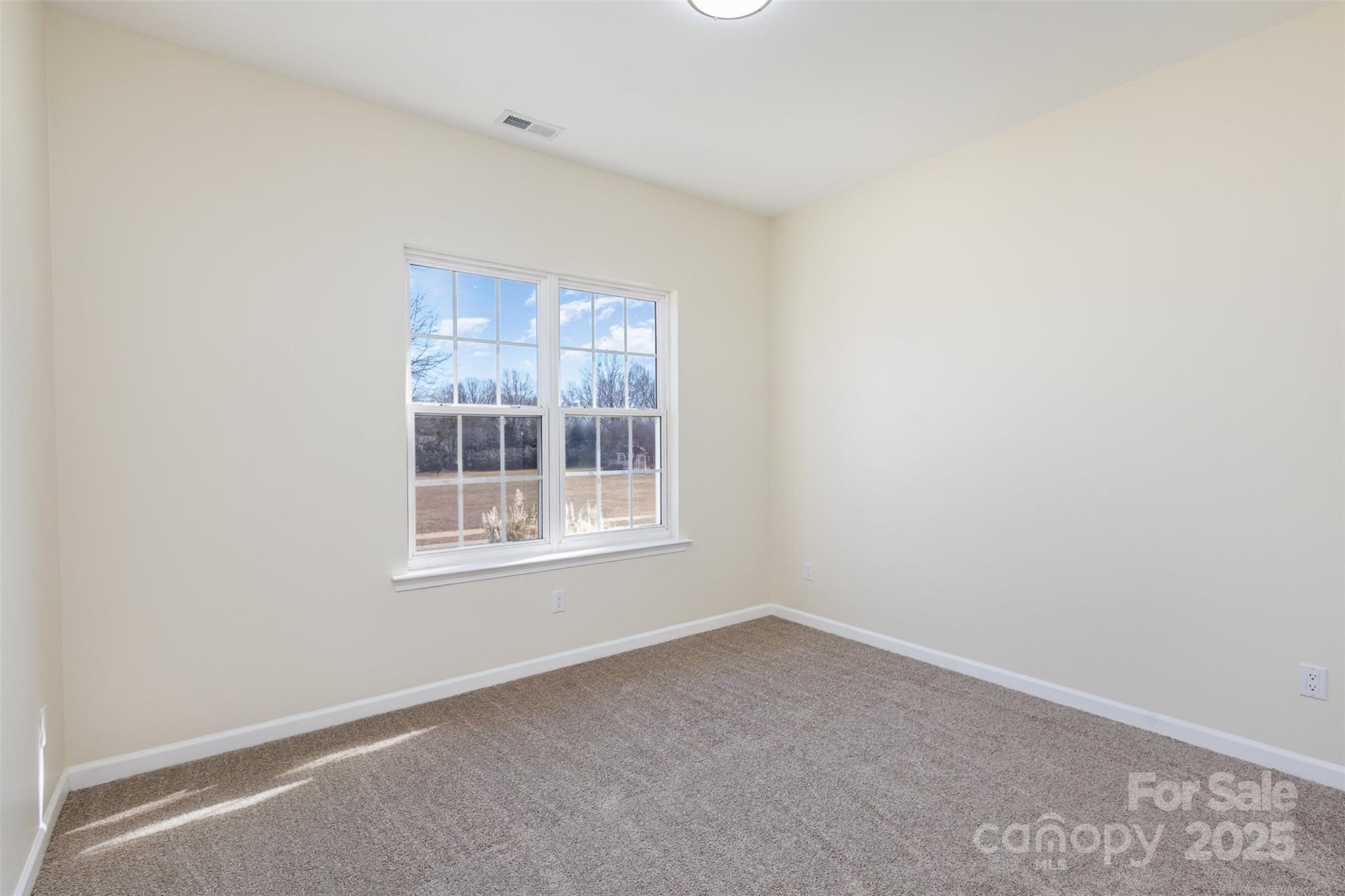 132 Elizabeth Hearth Road Mooresville, NC 28115 - Photo 28 of 40 an empty room with a window