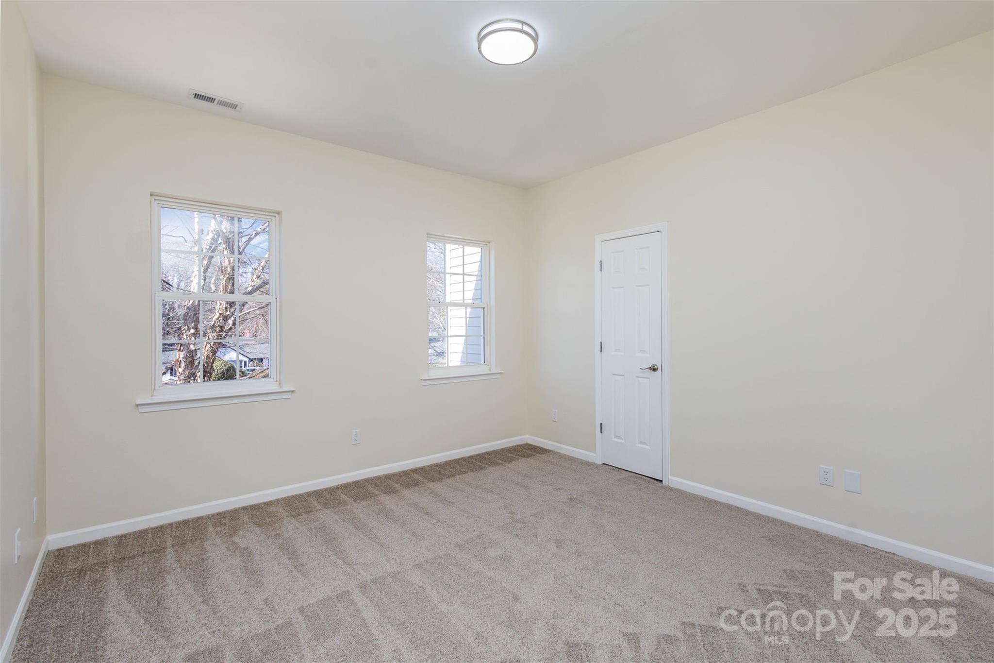 132 Elizabeth Hearth Road Mooresville, NC 28115 - Photo 29 of 40 an empty room with windows and closet
