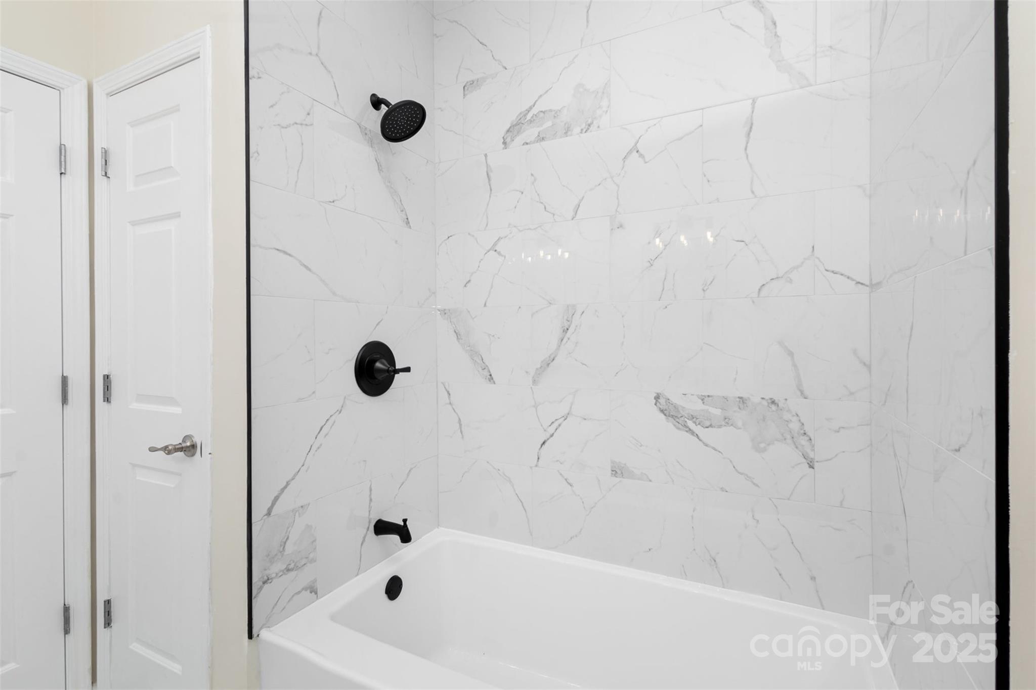 132 Elizabeth Hearth Road Mooresville, NC 28115 - Photo 31 of 40 a bathroom with a tub