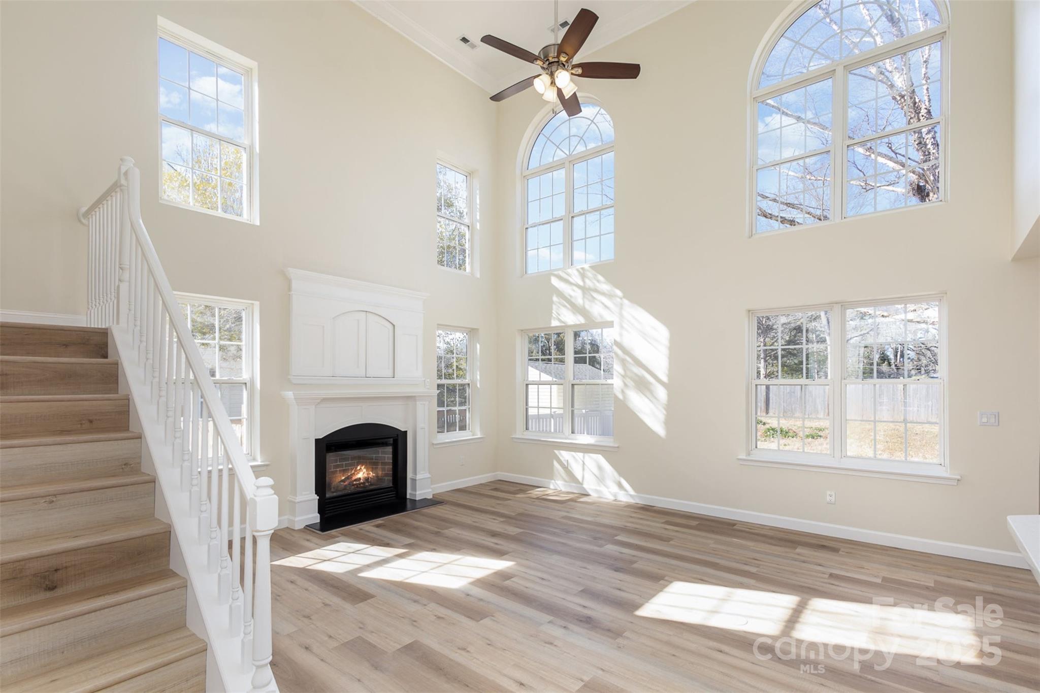 132 Elizabeth Hearth Road Mooresville, NC 28115 - Photo 8 of 40 a view of livingroom window and fireplace