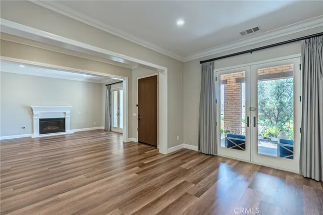 a kitchen with stainless steel appliances granite countertop a sink stove and wooden floor