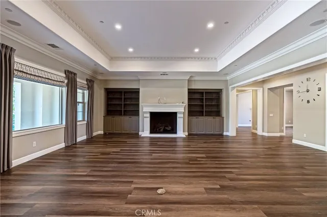 a kitchen with stainless steel appliances granite countertop a sink and wooden cabinets
