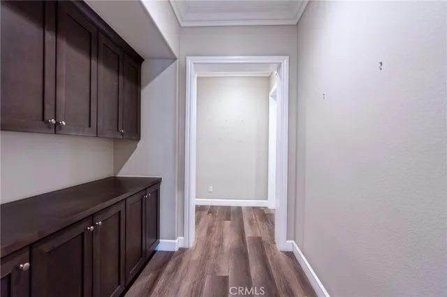 an empty room with wooden floor