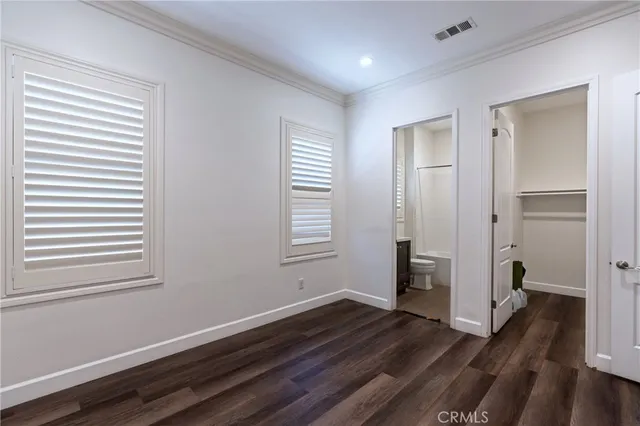 a kitchen with a wooden floor and a yard
