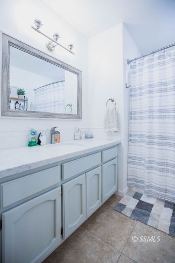 199 East Upjohn Avenue Ridgecrest, CA 93555 - Photo 18 of 30 a spacious bathroom with double sink and a shower