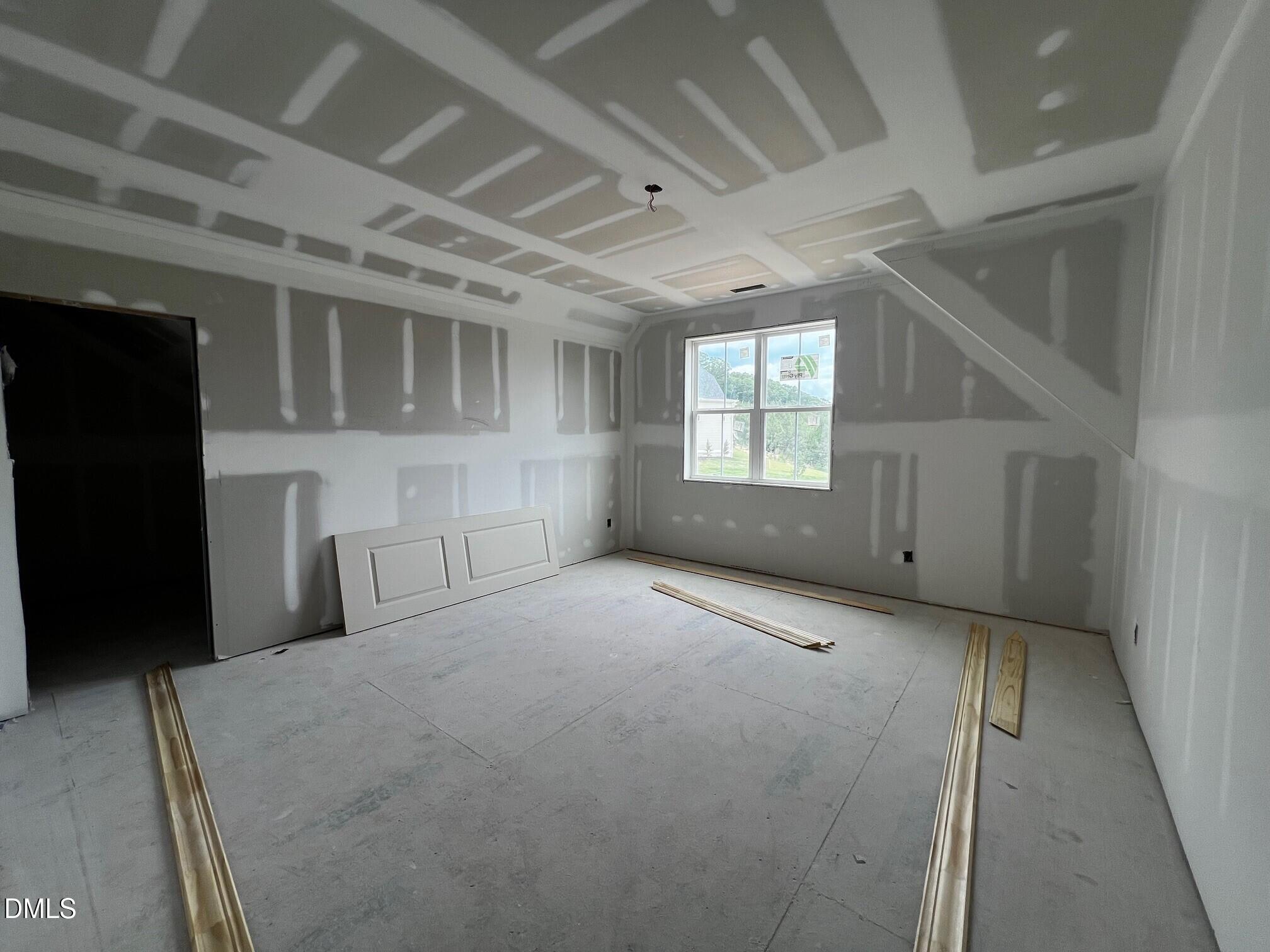 1675 Terry Road Durham, NC 27712 - Photo 14 of 23 a view of an empty room with a window