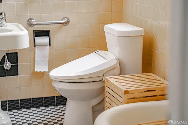 a bathroom with a toilet and a sink