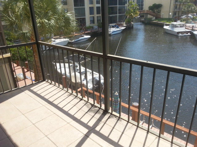a view of balcony with wooden floor