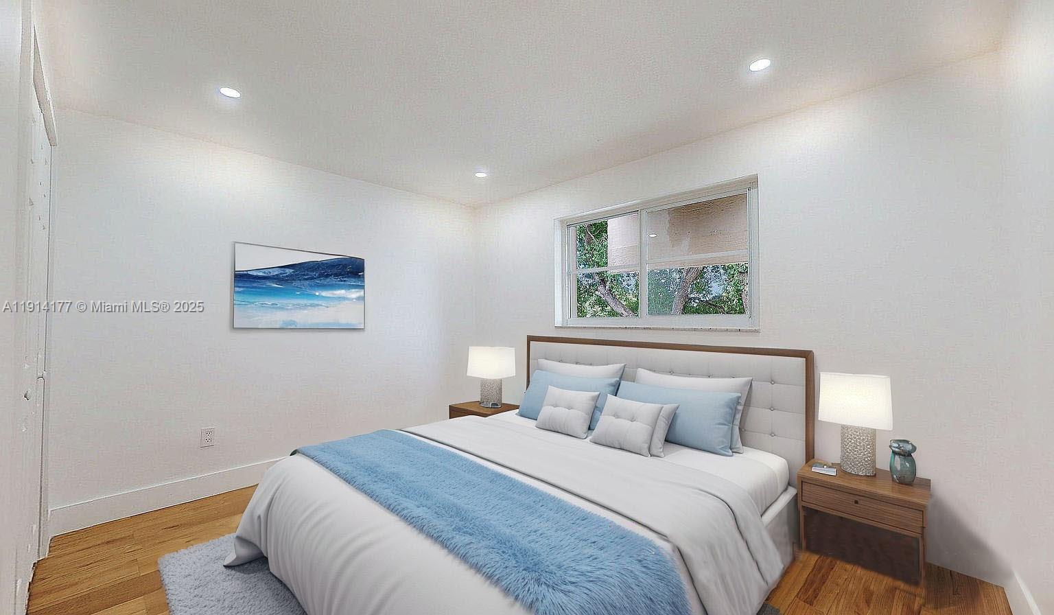 1201 Southwest 42nd Avenue, Unit 211 Miami, FL 33134 - Photo 12 of 19 a bedroom with a large bed and a window