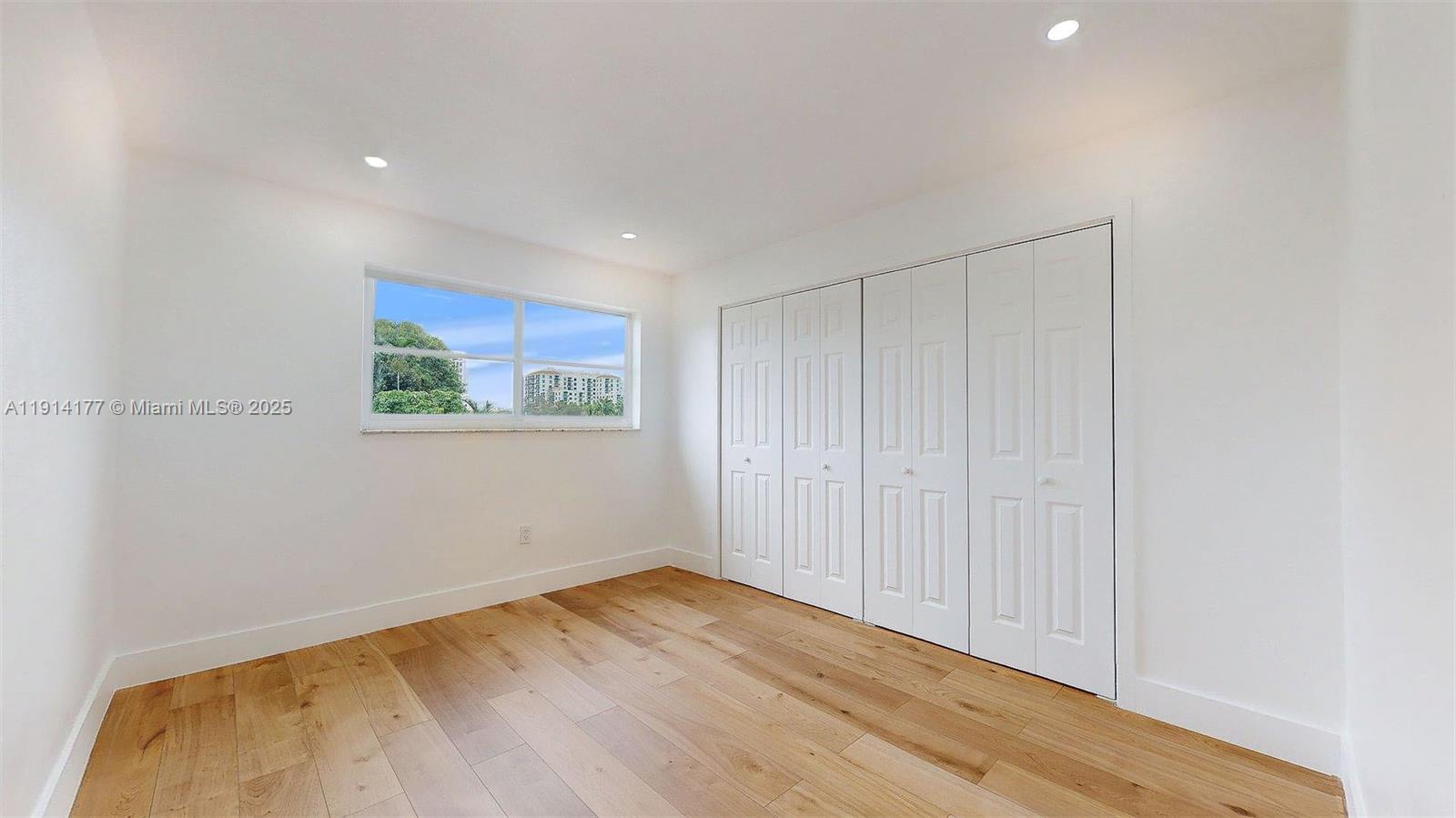 1201 Southwest 42nd Avenue, Unit 211 Miami, FL 33134 - Photo 16 of 19 a view of empty room with wooden floor