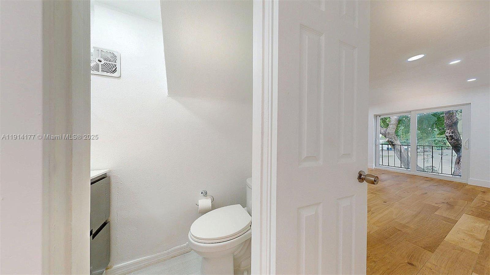 1201 Southwest 42nd Avenue, Unit 211 Miami, FL 33134 - Photo 6 of 19 a bathroom with a sink and toilet