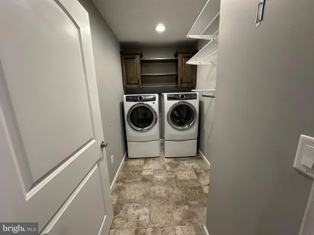 a view of a room with wooden racks