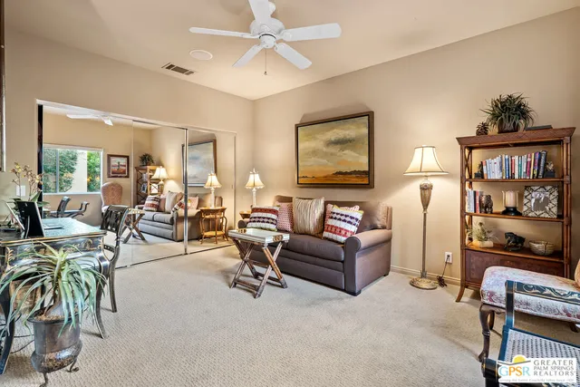 a bathroom with a granite countertop sink toilet a mirror and shower