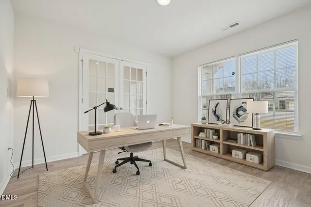 a view of a workspace with furniture