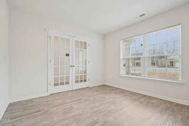 an empty room with windows