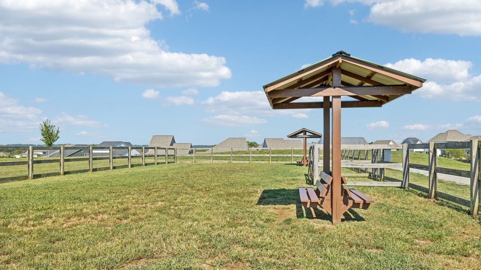 329 Harvest Point Boulevard Spring Hill, TN 37174 - Photo 16 of 45 a view of a wooden chairs and table in the yard