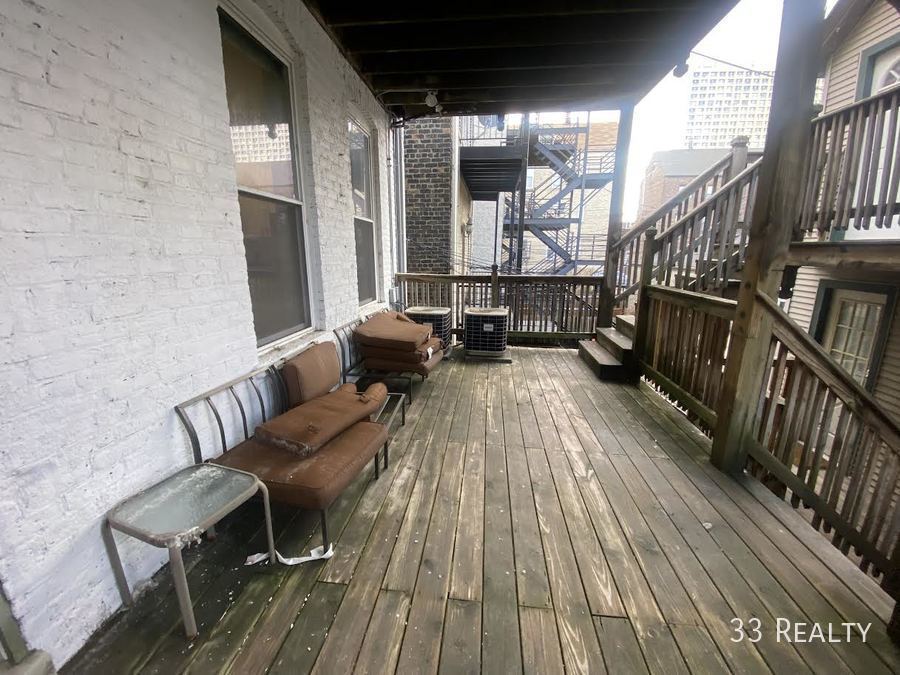 1246 North Cleaver Street, Unit 1R Chicago, IL 60642 - Photo 8 of 8 a view of balcony with furniture
