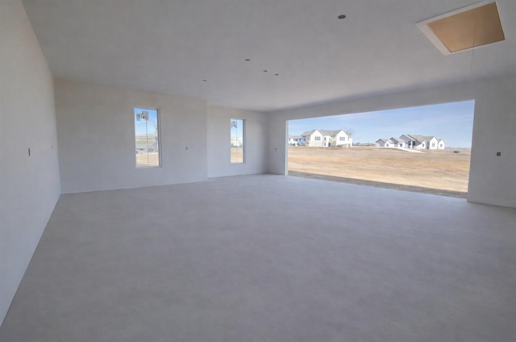 176 Vaughn Lane Calera, OK 74730 - Photo 17 of 21 an empty room with windows
