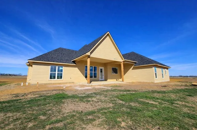 a front view of a house with yard