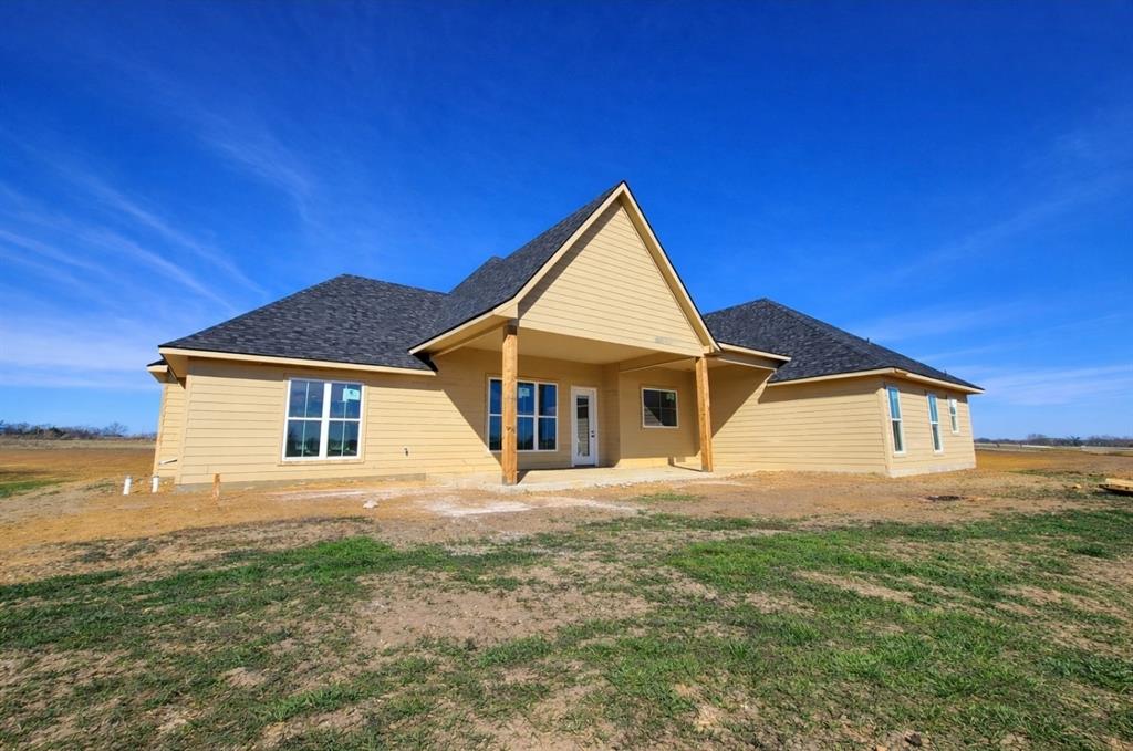176 Vaughn Lane Calera, OK 74730 - Photo 19 of 21 a front view of a house with yard