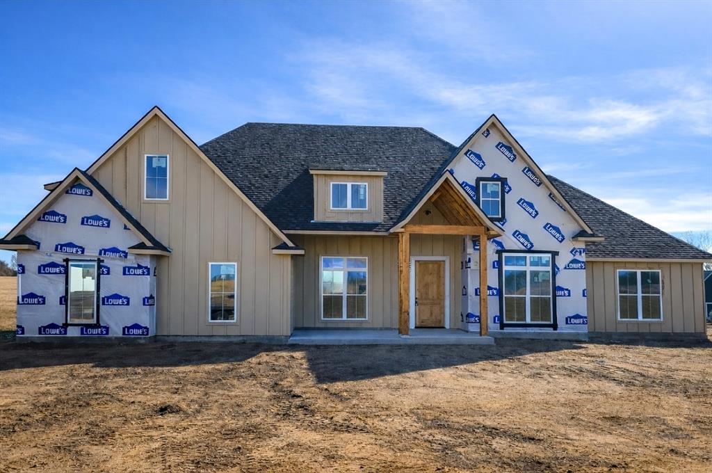 176 Vaughn Lane Calera, OK 74730 - Photo 20 of 21 a front view of a house with a yard