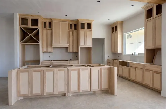 a kitchen with stainless steel appliances granite countertop a sink and cabinets