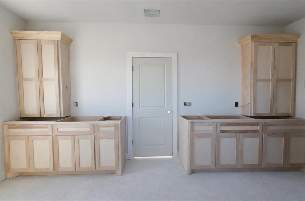 176 Vaughn Lane Calera, OK 74730 - Photo 7 of 21 a view of cabinets with wooden floor