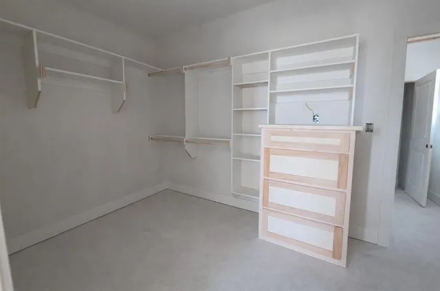 a view of an empty walk in closet
