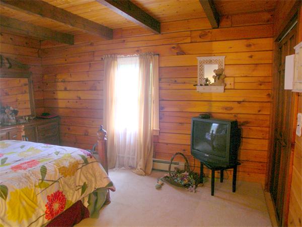 64 Bethany Road Framingham, MA 01702 - Photo 13 of 30 a bedroom with a bed and a chair