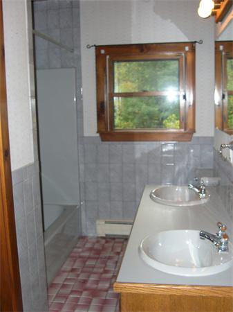 64 Bethany Road Framingham, MA 01702 - Photo 21 of 30 a bathroom with a sink and a large mirror
